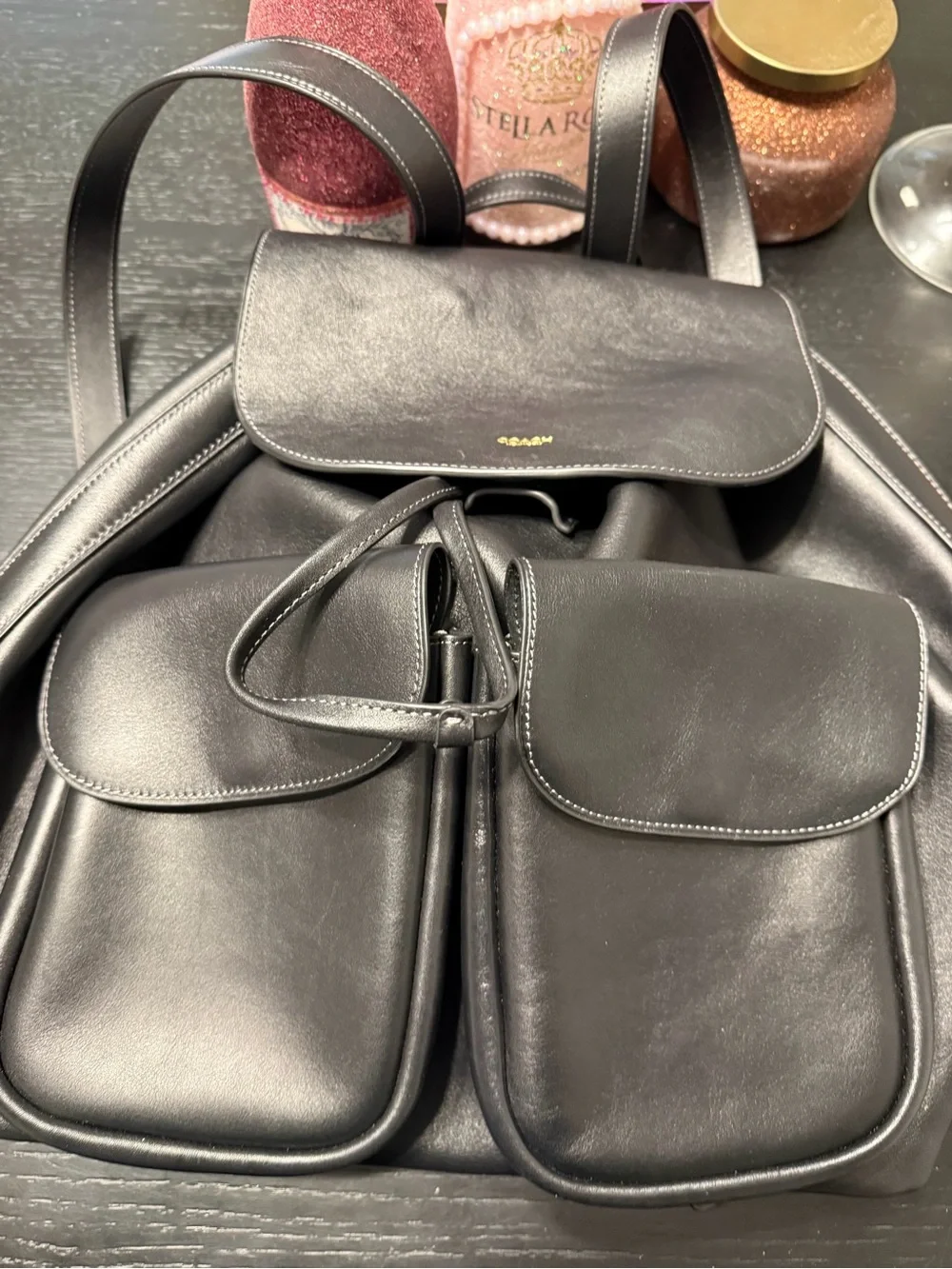 Coach Black Leather Backpack with Dual Front Flap Pockets and Drawstring